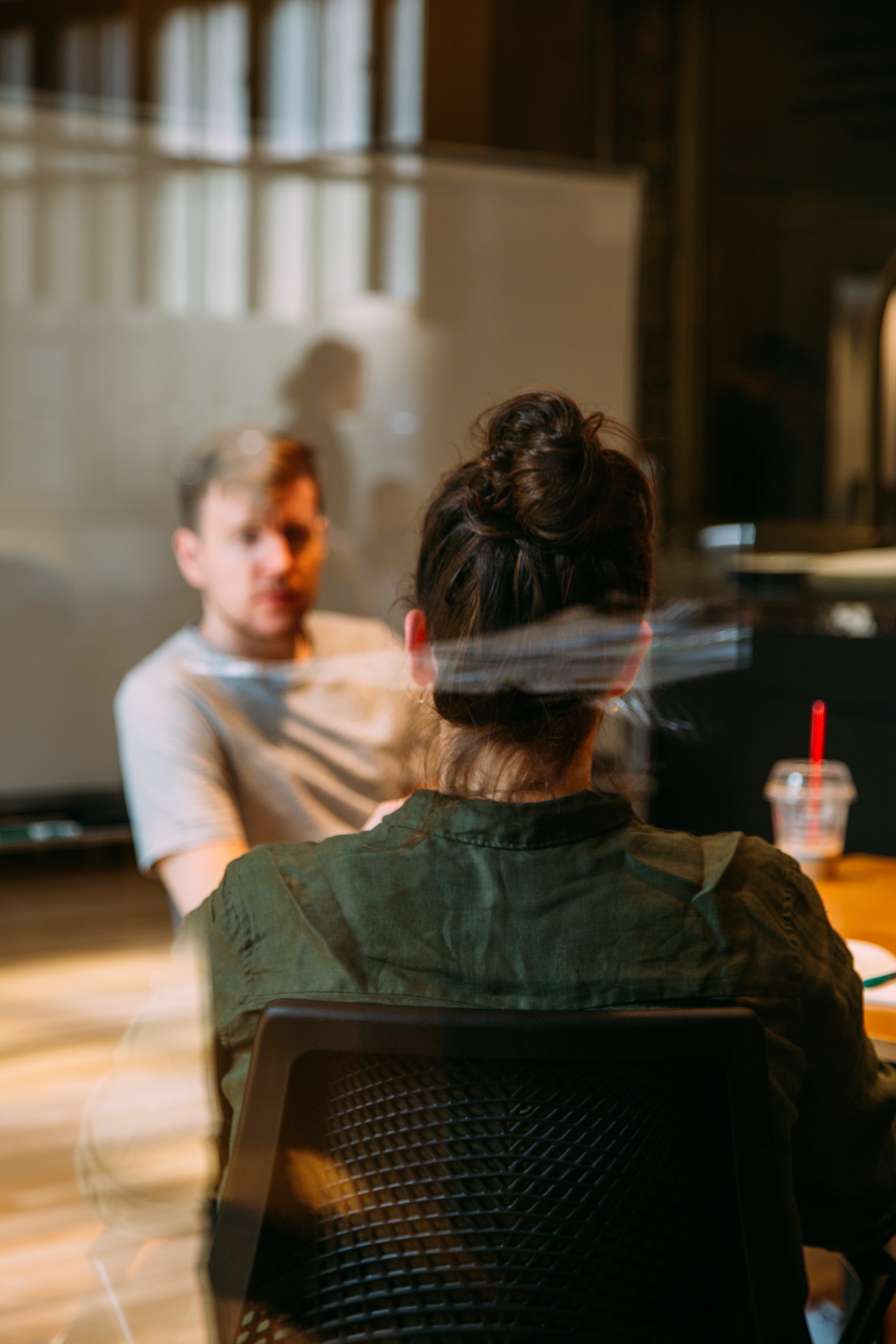 Four people sitting at a table at work