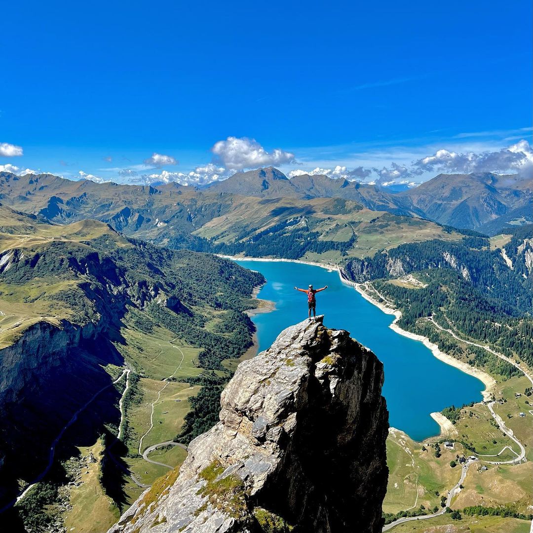 a man standing on top of a mountain